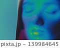 Woman face glowing with thermal infrared heat colors 139984645