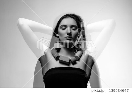 Woman double exposure portrait with abstract geometric necklace 139984647