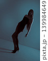 Woman model posing in mysterious blue lighting concept 139984649