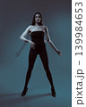 Woman posing with motion blur double exposure effect 139984653