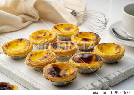 Egg custard tart dessert on wooden plate 139984688
