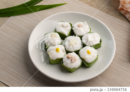Thai pudding with coconut topping and corn,taro. Thai pudding with coconut topping and corn,taro. 139984738