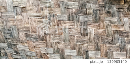 Old bamboo weaving pattern with natural brown color Old bamboo weaving pattern with natural brown color 139985140