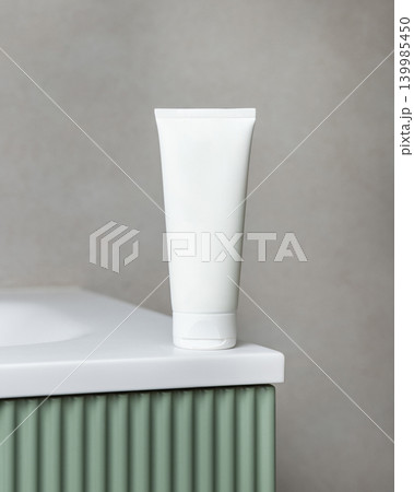 White blank cream tube mockup on green bathroom vanity. Skincare cosmetic packaging White blank cream tube mockup on green bathroom vanity. Skincare cosmetic packaging 139985450