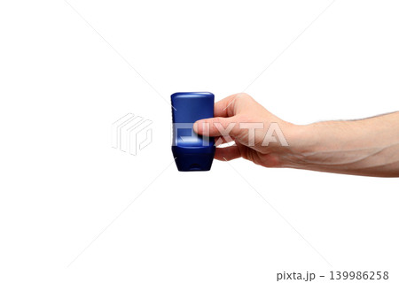 male hand squeezing a blue plastic gel bottle on a white background 139986258