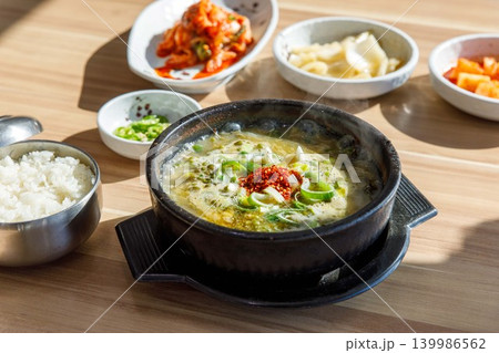 Traditional Jeju Pork and Seaweed Soup Momguk in Earthenware Pot Traditional Jeju Pork and Seaweed Soup Momguk in Earthenware Pot 139986562