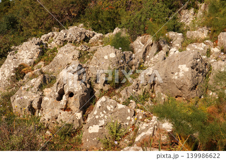 Rocky limestone terrain in Bitez, Bodrum, Turkey, with Mediterranean scrubland and wild vegetation growing 139986622
