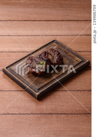 Beef mignon steak, rare, meat grilled with salt and spices. Beef steak Beef mignon steak, rare, meat grilled with salt and spices. Beef steak 139986709