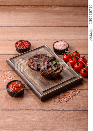 Beef mignon steak, rare, meat grilled with salt and spices. Beef steak Beef mignon steak, rare, meat grilled with salt and spices. Beef steak 139986716