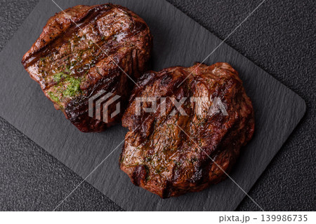 Beef mignon steak, rare, meat grilled with salt and spices. Beef steak Beef mignon steak, rare, meat grilled with salt and spices. Beef steak 139986735