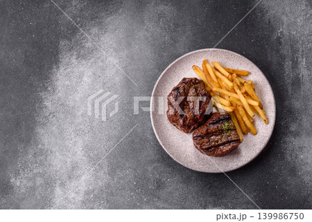 Beef mignon steak, rare, meat grilled with salt and spices. Beef steak Beef mignon steak, rare, meat grilled with salt and spices. Beef steak 139986750