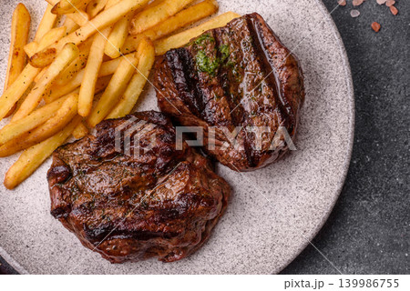 Beef mignon steak, rare, meat grilled with salt and spices. Beef steak Beef mignon steak, rare, meat grilled with salt and spices. Beef steak 139986755