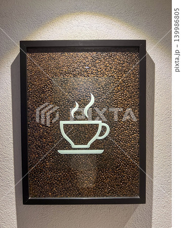 Cozy cafe interior featuring a stylish wall with a coffee-themed sign. Warm atmosphere, modern decor, typography, and coffee shop lifestyle concept. Perfect for cafe, coffee culture, and interior Cozy cafe interior featuring a stylish wall with a coffee-themed sign. Warm atmosphere, modern decor, typography, and coffee shop lifestyle concept. Perfect for cafe, coffee culture, and interior 139986805