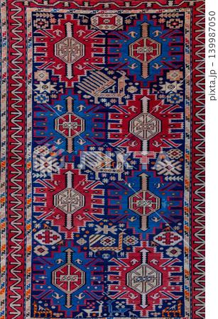 Authentic traditional Alpan carpet from the Cuban group of Azerbaijan featuring detailed geometric ornaments, rich woven texture, and colorful ethnic patterns. Decorative oriental rug inspired by 139987050