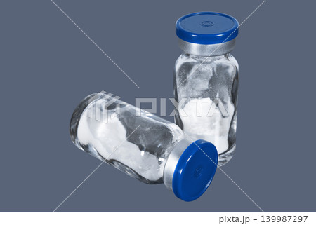 Medical vials with white powder vaccine Medical vials with white powder vaccine 139987297