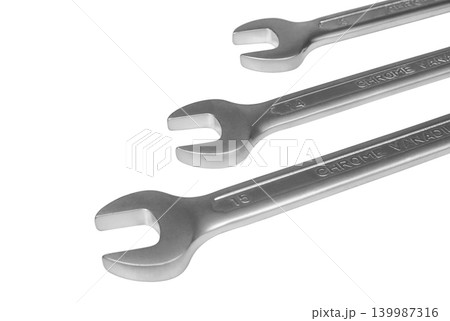 Metal spanners on white background close up Metal spanners on white background close up 139987316