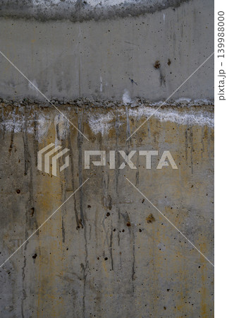 Vertical old concrete wall with water damage texture 139988000