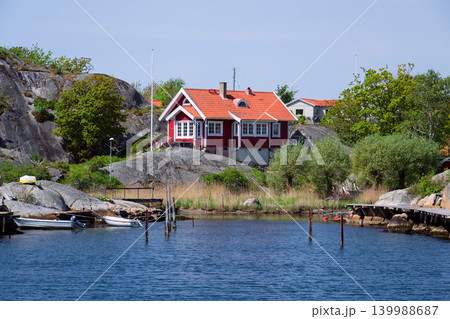 Beautiful holiday cottages on shore of Gothenburg archipelago islands, Gothenburg Minucipality, Vastra Gotaland County, Sweden, sunny day Beautiful holiday cottages on shore of Gothenburg archipelago islands, Gothenburg Minucipality, Vastra Gotaland County, Sweden, sunny day 139988687