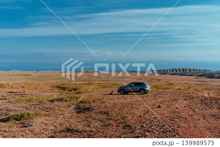 Car on plain in the mountains in spring Car on plain in the mountains in spring 139989575