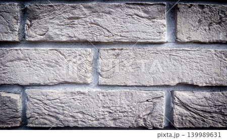 Light gray decorative stone brick wall texture background for facade cladding and interior architecture 139989631