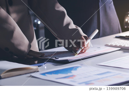 Accountants processing financial documents and taxes, managing corporate finance in a modern office. Audit and taxes in business 139989706