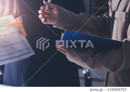 Accountants processing financial documents and taxes, managing corporate finance in a modern office. Audit and taxes in business 139989707