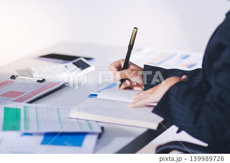 Accountants processing financial documents and taxes, managing corporate finance in a modern office. Audit and taxes in business 139989726