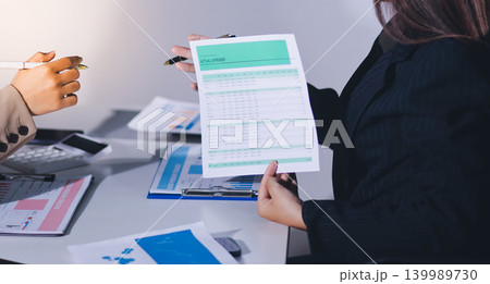 Accountants processing financial documents and taxes, managing corporate finance in a modern office. Audit and taxes in business 139989730