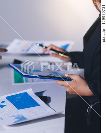 Accountants processing financial documents and taxes, managing corporate finance in a modern office. Audit and taxes in business 139989731