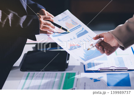Accountants processing financial documents and taxes, managing corporate finance in a modern office. Audit and taxes in business 139989737