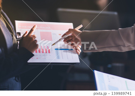 Accountants processing financial documents and taxes, managing corporate finance in a modern office. Audit and taxes in business 139989741