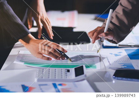 Accountants processing financial documents and taxes, managing corporate finance in a modern office. Audit and taxes in business 139989743
