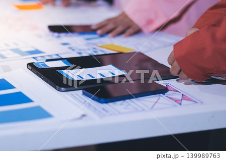 team of UI UX web designer are working together to develop mobile responsive websites with UI UX front end designer previews 139989763