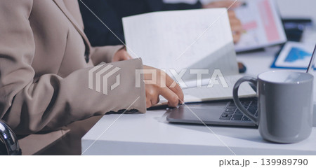 Accountants processing financial documents and taxes, managing corporate finance in a modern office. Audit and taxes in business 139989790
