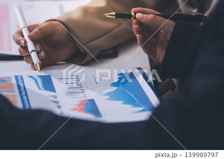 Accountants processing financial documents and taxes, managing corporate finance in a modern office. Audit and taxes in business Accountants processing financial documents and taxes, managing corporate finance in a modern office. Audit and taxes in business 139989797
