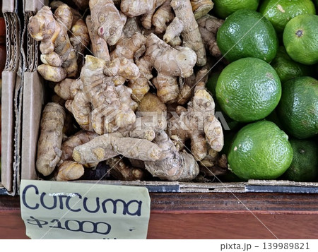Cordoba, Argentina - April 9, 2026: turmeric rhizomes and limes at produce market 139989821
