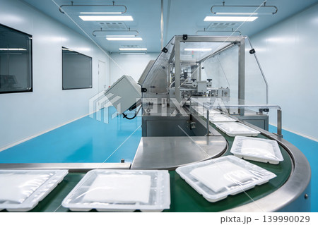 Automated packaging machine in a sterile cleanroom environment for product manufacturing Automated packaging machine in a sterile cleanroom environment for product manufacturing 139990029