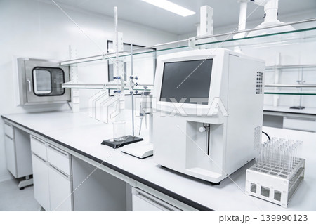 Modern laboratory equipment setup with analytical instruments and glassware Modern laboratory equipment setup with analytical instruments and glassware 139990123