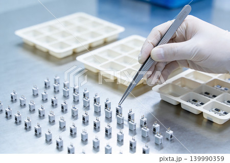 Precision assembly of electronic components in a cleanroom environment Precision assembly of electronic components in a cleanroom environment 139990359