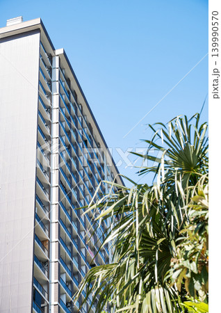 Modern high-rise residential buildings with beautiful new facades against a clear blue sky. Modern high-rise residential buildings with beautiful new facades against a clear blue sky. 139990570