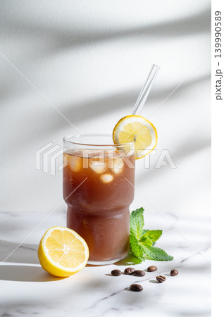 Cold Coffee Tonic Drink With Lemon and Ice 139990589