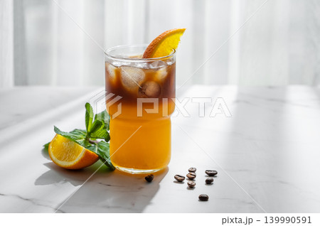 Cold bumble coffee with orange juice and ice Cold bumble coffee with orange juice and ice 139990591