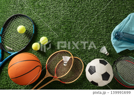 Mixed sports equipment on green grass with copy space 139991699