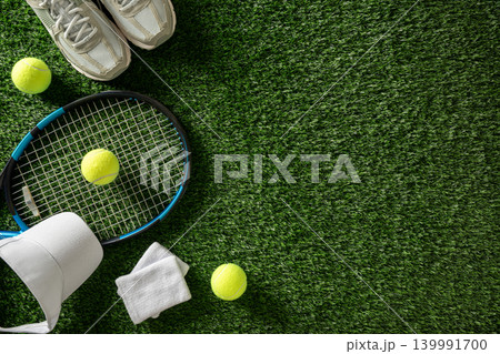Tennis accessories and sneakers on grass background Tennis accessories and sneakers on grass background 139991700