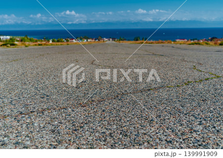 Empty wide paved road on sea background Empty wide paved road on sea background 139991909