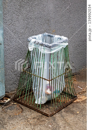 Empty plastic trash bin on street Empty plastic trash bin on street 139992034
