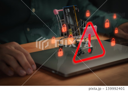 Online shopping fraud alert with cyber security warning. Credit card in cart with data breach icons for secure payment and digital safety protection on laptop. 139992401