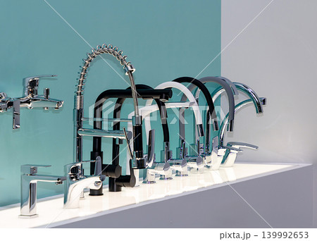 Row of modern kitchen taps 139992653