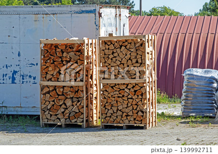 Pile of cut wood outside 139992711