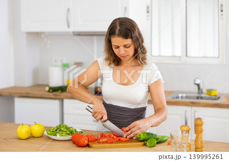 Woman cooking salad at home 139995261